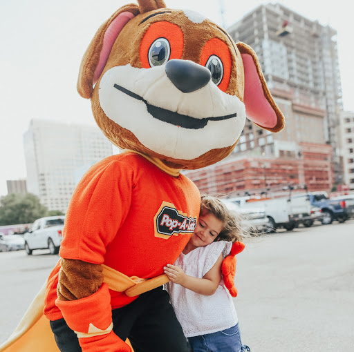 PAL Saves Kids Emergency Door Unlock Mascot Hugging a Child